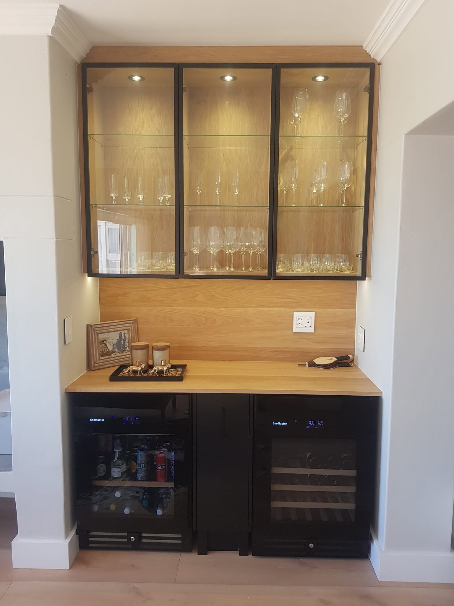 Bar with lit glass cabinet