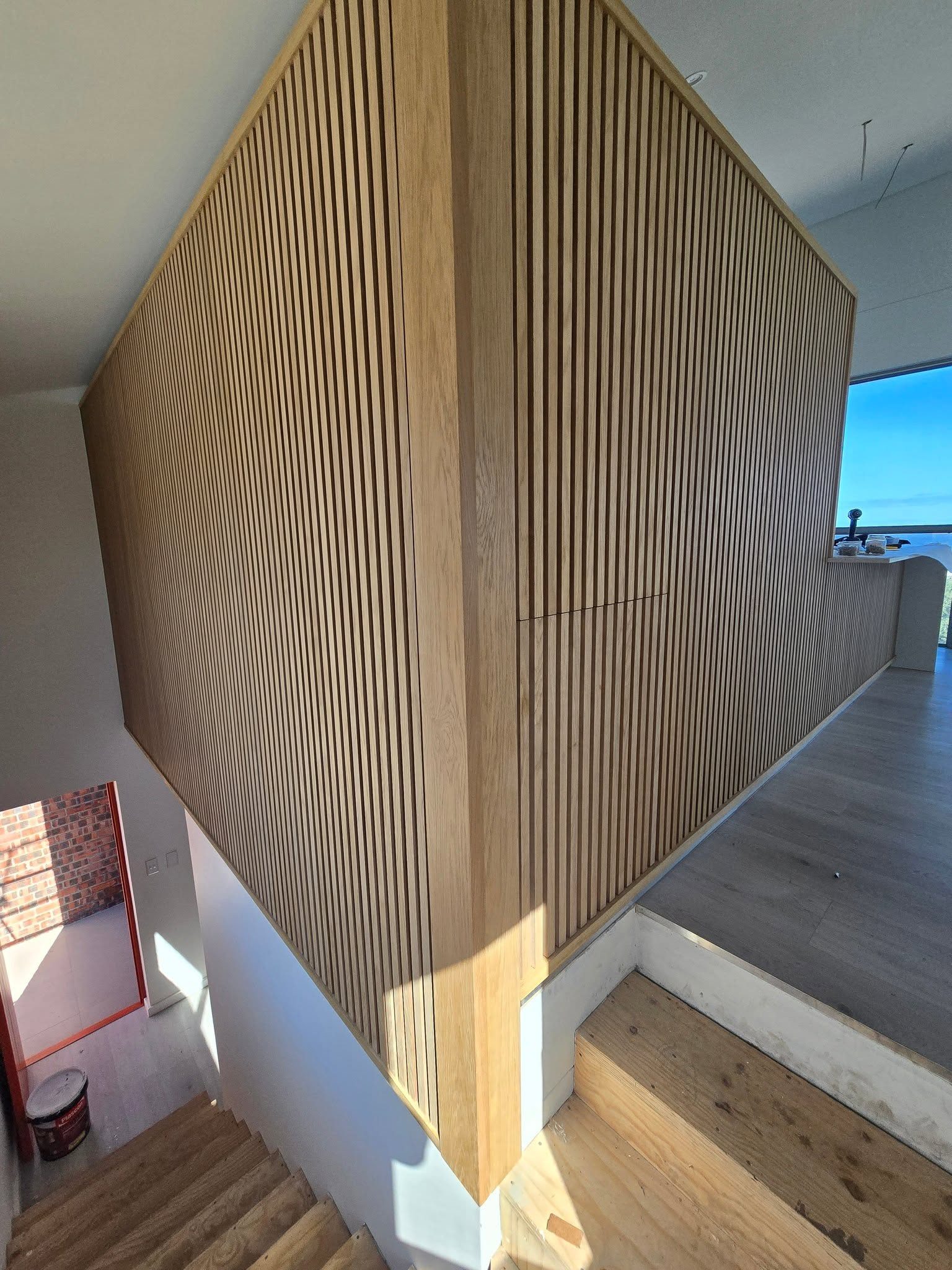 Oak slat screen at the stairs